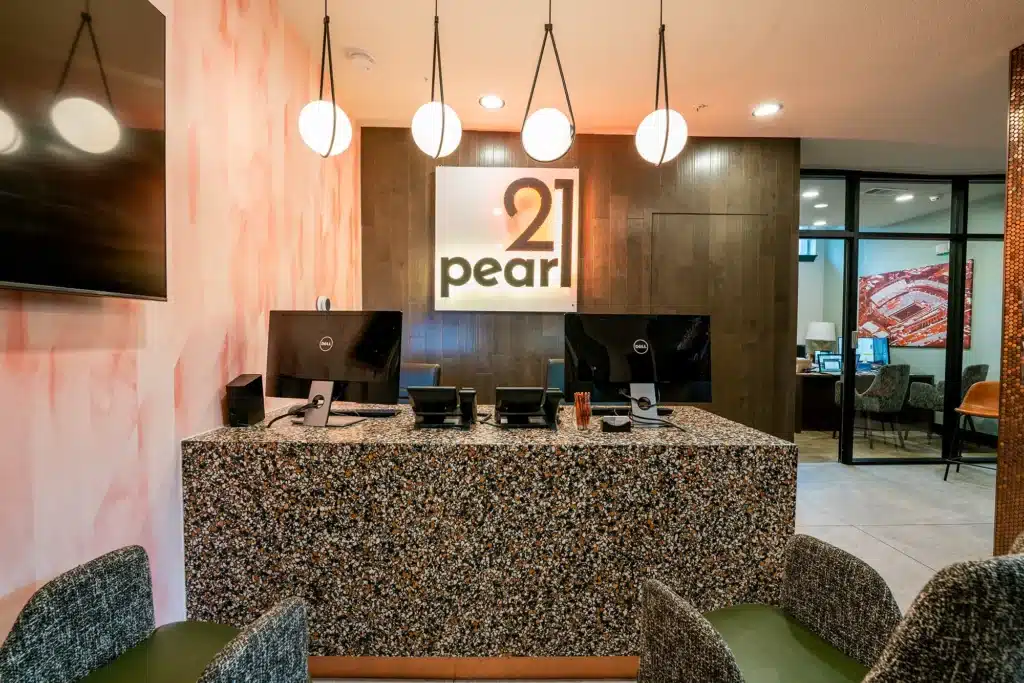 21 Pearl Off Campus Apartments in West Campus Near UT Austin Leasing Office Desk